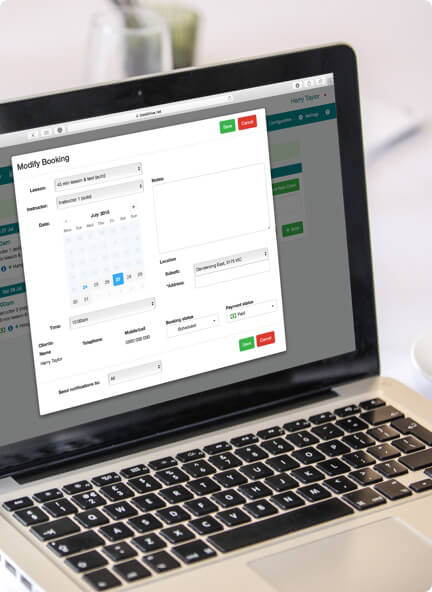 Laptop showing online booking system dashboard